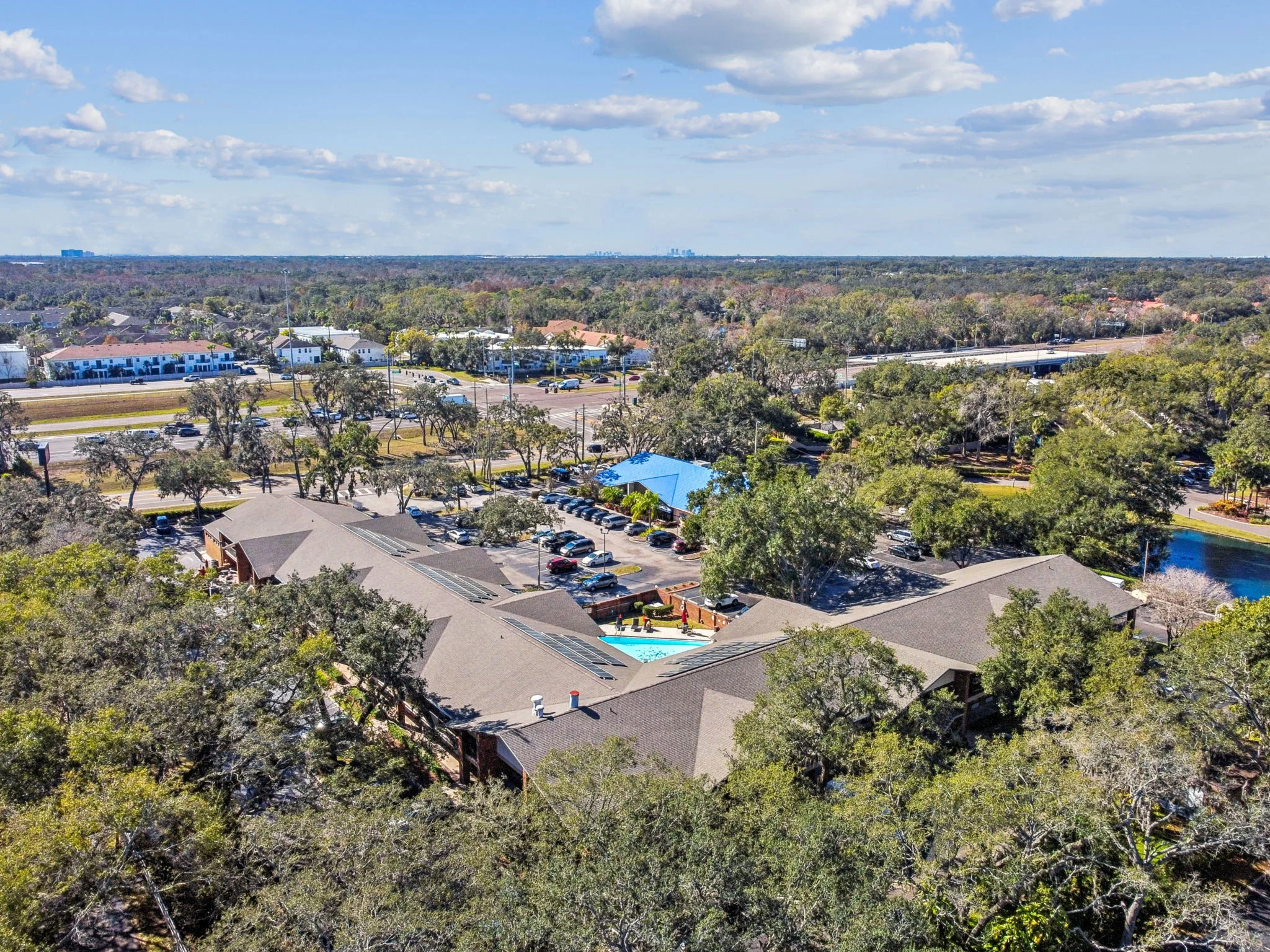 Aerial side angle of hotel buildings with rooftop solar panels